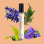 Roll-on bottle labeled 'Earth's Desire' with lavender and green leaves on a peach background